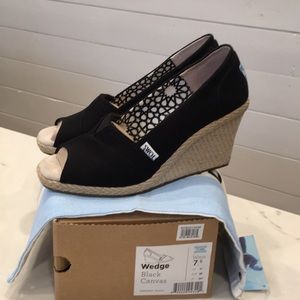 Toms black wedges. Lightly worn.